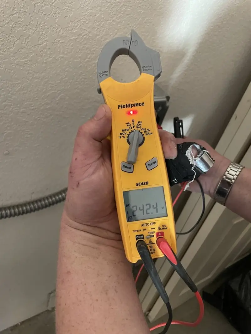 Voltage testing with clamp meter during Ceiling Fan Installation in Bloomfield